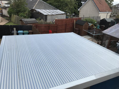 New pent garage roof with galvanised corrugated steel roof sheets
